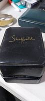 Black hinged box with Sheffield 1905 logo