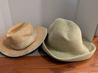 Two woven hats side by side