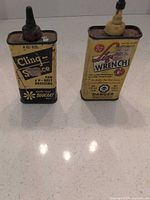 Front view of both oil cans showing labels