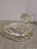 Two-piece clear glass duck covered dish assembled