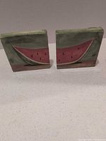 front view of both watermelon tiles standing side by side
