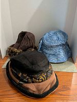 All three women’s hats displayed together