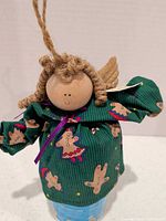 Front view of angel ornament showing dress pattern, head, wings and hanger