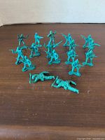 Group view of 17 green plastic army men