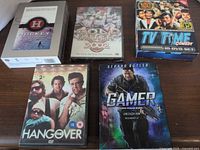 Overview of all five DVD cases and box sets on table