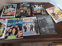 All eight DVD cases laid out on table