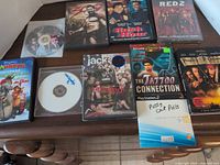 All ten discs and cases arranged on table, showing titles and quantity