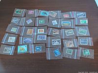 All 30 stamps laid out in sleeves
