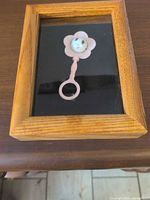 Rattle in shadow box, full view