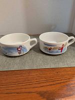 Front view of both Campbell's Kids soup bowls showing graphics and handles