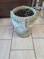 Full view of concrete planter showing rim and pedestal