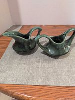 Both ceramic pieces side by side on table