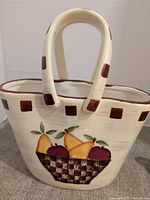 Cream glass purse basket with fruit painting and brown accents