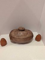Potato storage pot flanked by two potato-shaped shakers
