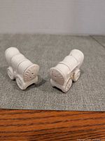 Front angled view of both covered wagon shakers