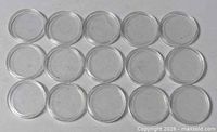 Top view of all 15 clear coin capsules