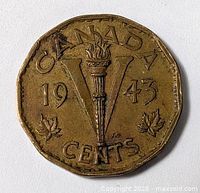 Reverse of 1943 Canadian 5-cent Victory coin showing torch in V and maple leaves