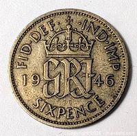 Reverse side of 1946 sixpence with crowned monogram and date