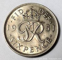 Reverse side showing crowned GR VI monogram, date 1951, denomination SIXPENCE