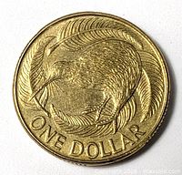 Reverse of coin showing kiwi and fern design with ONE DOLLAR legend