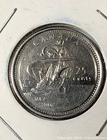 Reverse of 2004 25-cent coin showing sailing ship and dual date 1604-2004