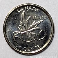 Reverse of 2017 Canada 10-cent coin showing maple leaf design and 1867-2017 legend