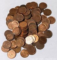 Pile of Canadian pennies showing maple leaf reverse
