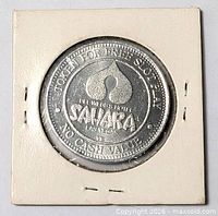 Front of Sahara Las Vegas slot token in flip