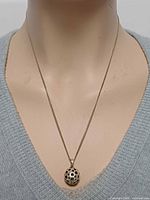 Necklace on mannequin frontal view showing pendant drop