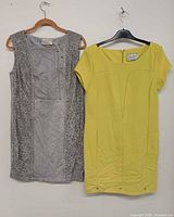 Front view of both dresses hanging