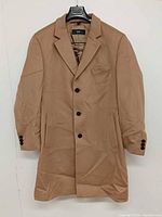 Front view of camel Hugo Boss long coat on hanger