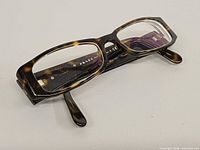 Top view of Prada tortoiseshell rectangular eyeglasses showing clear lenses and frame front