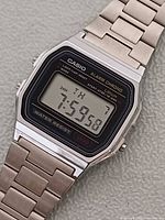 Front view showing Casio A158W-1 digital face with time displayed