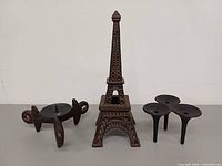 Three candle holders side by side showing overall forms