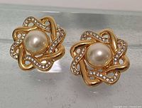 Front view of both earrings showing design and condition