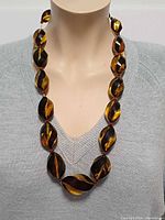 Necklace on bust showing bead size and colour