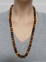 Necklace worn on mannequin showing length and beads
