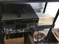 Front view of DVW-500 showing cassette slot, control panel and jog dial