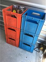Two stacks of three plastic crates each, one stack orange and one blue, showing 'Beatrice Yards' embossed logos on sides.