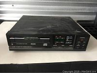 Front view of the Philips CD 160 player showing control buttons and CD tray.