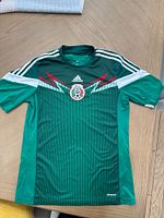 Full front view of green Adidas Mexico ClimaCool soccer jersey