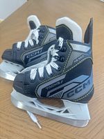 Both skates side view showing uppers, laces and tongues