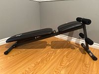 Full side view of Marcy decline ab bench showing overall structure and condition