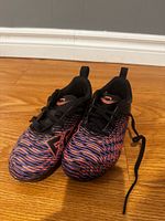 pair of cleats angled front view