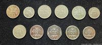 Obverse sides of 11 Jamaican coins on black background
