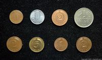 Obverse of eight West German coins showing denominations and dates