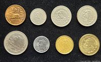 Obverse sides of eight Mexican coins displayed on black background