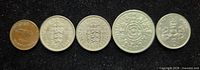 obverse of five British coins aligned