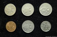 Six Bermuda coins obverse designs visible on black background