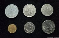 Obverse sides of six French coins showing denominations and years